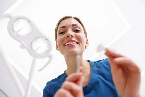 Low Angle View Female Dentist Holding Angled Mirror While Checking — Stock Photo, Image