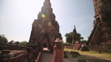 Young Asian women tourist traveling at Wat Chaiwatthanaram, ancient buddhist temple, famous and major tourist attraction religious of Ayutthaya Historical Park, Thailand, This temple is public places