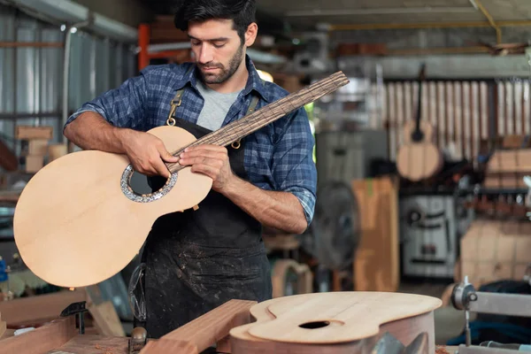 stock image Luthier making a guitar and using traditional tools in workroom with manual tools