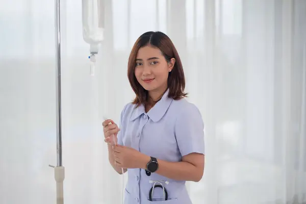 Asian Nurse Wear Checking Saline Bag Patient Hospital Room Healthcare Stock Photo