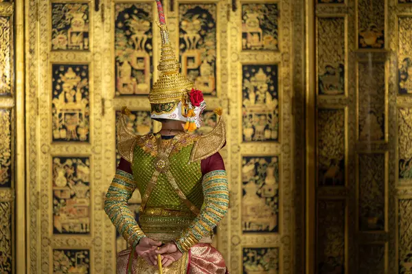 stock image Pantomime (Khon) is traditional Thai classic masked play enacting scenes from the Ramakien (Ramayana) with a backdrop of Thai paintings in a public place at Wat Phra Khao, Ayutthaya province, Thailand