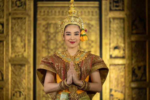 stock image Pantomime (Khon) is traditional Thai classic masked play enacting scenes from the Ramakien (Ramayana) with a backdrop of Thai paintings in a public place at Wat Phra Khao, Ayutthaya province, Thailand