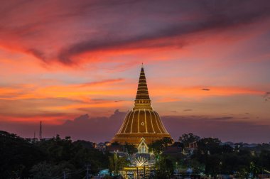 Golden pagoda Phra Pathom Chedi sunset of Nakhon Pathom province, landmark and famous place of Thailand clipart