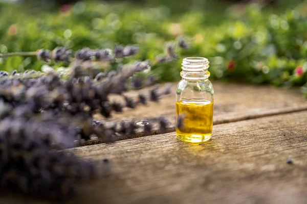 Essential Oil Small Glass Bottle Sprigs Lavender Wood Table Blurred — Stock Photo, Image