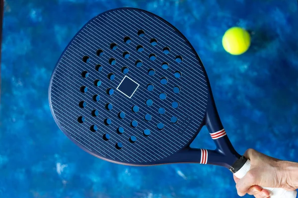 blue professional paddle tennis racket and balls on blue color background. Horizontal sport theme poster, greeting cards, headers, website and app