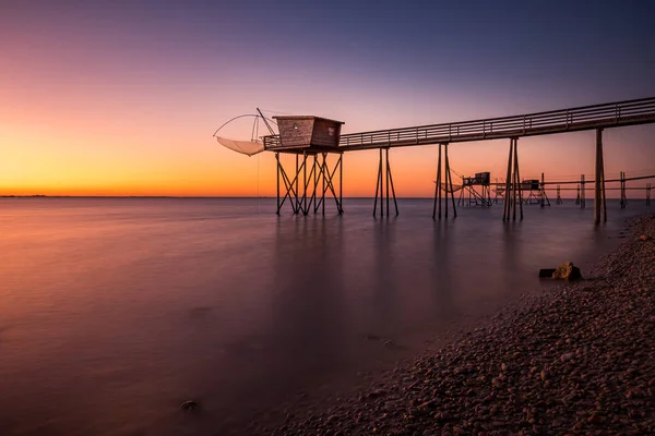 stock image Fishing hut on stilts coast of Atlantic ocean at sunset near La Rochelle, Charente Maritime, France