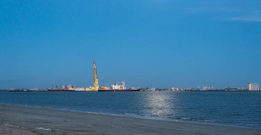 View of La Pallice, from rivedoux, re island, the trade port of La Rochelle. freight ships and huge crane in the trade port. Banner format clipart