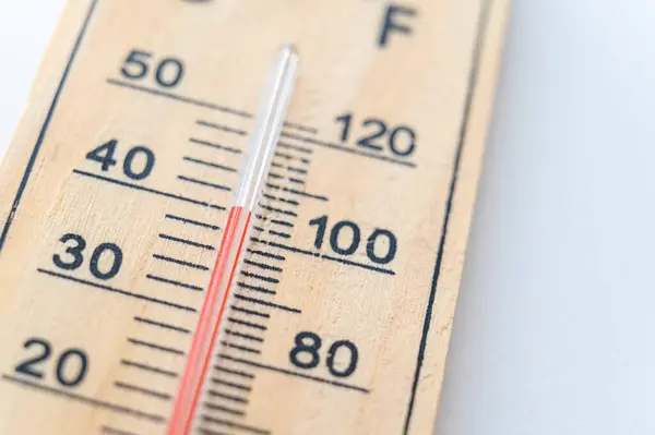 stock image Thermometer on a light surface, indicating high temperature. Global warming.