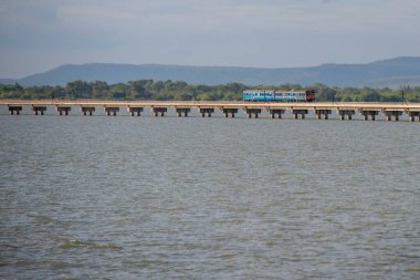 The Train bridge of the Rot Fai Loi Nam Train or floating train line at the Pa Sak Jolasid Dam in near the City of Lopburi in the Province of Lopburi in Thailand,  Thailand, Lopburi, November, 2022