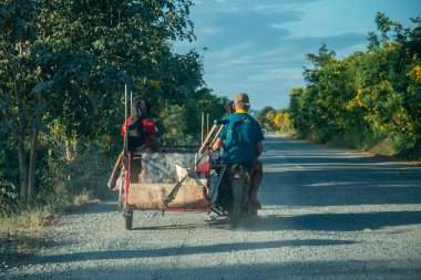 a Motobike on a road near the City of Lopburi in the Province of Lopburi in Thailand,  Thailand, Lopburi, November, 2022