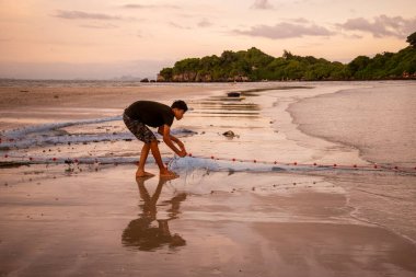 Fishermen at work at the Bo Thong Lang Bay and Beach at the Town of Bang Saphan in the Province of Prachuap Khiri Khan in Thailand,  Thailand, Bang Saphan, December, 2022