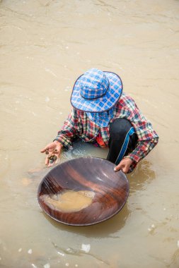 people are Gold washing at the Klong Thong River at tambon Ron Thong Village near the Town of Bang Saphan in the Province of Prachuap Khiri Khan in Thailand,  Thailand, Bang Saphan, December, 2022