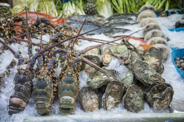 Thai Seafood at a Restaurant on the Nightmarket in the City of Hua Hin in the Province of Prachuap Khiri Khan in Thailand,  Thailand, Hua Hin, December, 2022