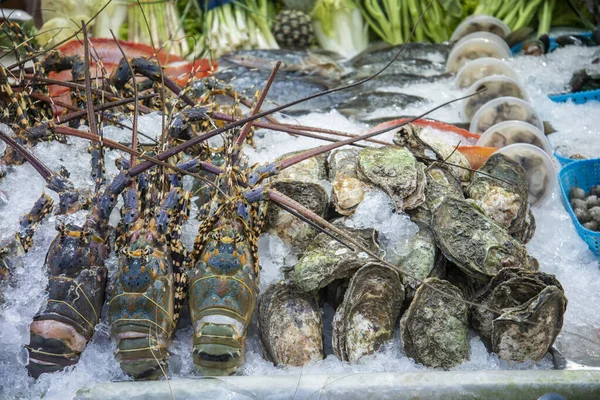 Thai Seafood at a Restaurant on the Nightmarket in the City of Hua Hin in the Province of Prachuap Khiri Khan in Thailand,  Thailand, Hua Hin, December, 2022