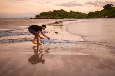 Fishermen at work at the Bo Thong Lang Bay and Beach at the Town of Bang Saphan in the Province of Prachuap Khiri Khan in Thailand,  Thailand, Bang Saphan, December, 2022