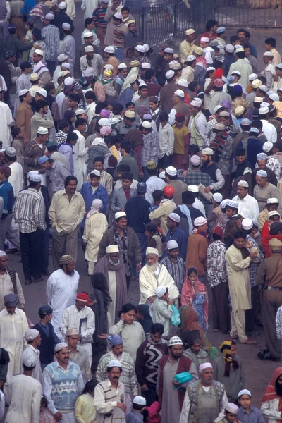 stock image Muslim People pray at the Break Ramadan Fest in front of the Jama Masjid Mosque in Old Delhi in the City of Delhi in India.  India, Delhi, February, 1998