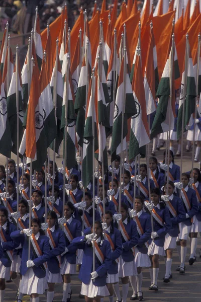 stock image a view with women and a Indian Flag a the Parade at the Republic Day on January, 26, 1998, in the city of New Delhi in India.  India, Delhi, January, 1998