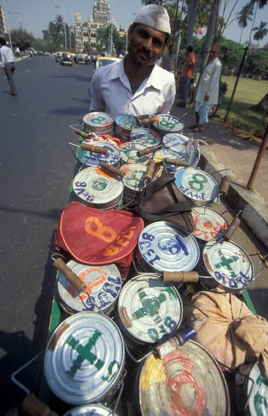 stock image Dabbawalas deliver Lunchboxes to the customers from the Mumbai Railway Station or Chhatrapati Shivaji Terminus in the city centre of Mumbai in India.  India, Mumbai, March, 1998