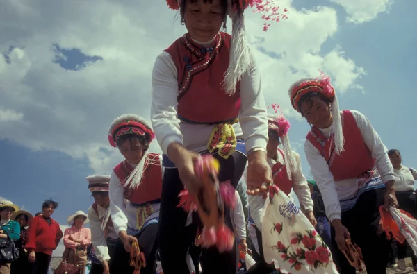 stock image chinese Minority People in traditional costum at a spring festival near the Town of Dali on the Er Hai Lake in the province of Yunnan in China in east asia.  China, Yunnan, April, 1996