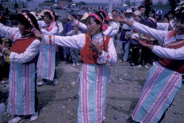 stock image chinese Minority People in traditional costum at a spring festival near the Town of Dali on the Er Hai Lake in the province of Yunnan in China in east asia.  China, Yunnan, April, 1996