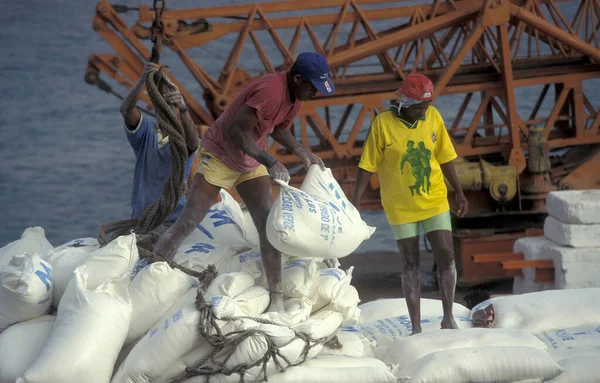 stock image Workers at the ship Pier terminal at the Ship Port of the city Praia on the Island of Santiago on the Cape Verde Islands in Africa. Cape Verde, Santiago, May, 2000