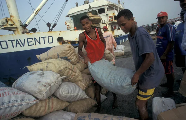 stock image Workers at the ship Pier terminal at the Ship Port of the city Praia on the Island of Santiago on the Cape Verde Islands in Africa. Cape Verde, Santiago, May, 2000