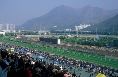 a horse Race at Sha Tin near the city of Hongkong in Hongkong.  China, Hongkong, May, 1997 clipart