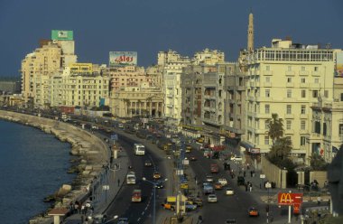 the coast at the al Corniche Road in the City of Alexandria on the Mediterranean Sea in Egypt in North Africa.  Egypt, Alexandria, March, 2000 clipart