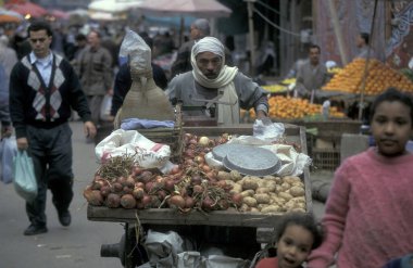 a Marketstreet at the main Bazaar or Market in the city of Cairo in Egypt in North Africa.  Egypt, Cairo, March, 2000 clipart