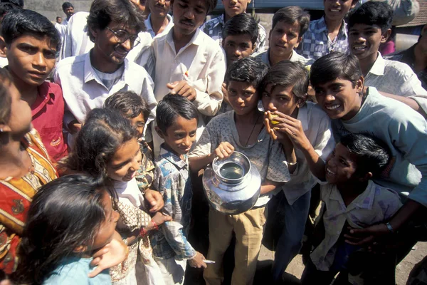 stock image people at a water station and water deep well in the city of Surat in the Province Gujarat in India.  India, Gujarat, April, 1998