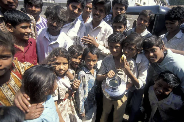 stock image people at a water station and water deep well in the city of Surat in the Province Gujarat in India.  India, Gujarat, April, 1998