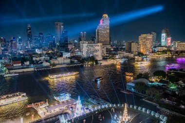 a skytrain with high Buildings in Silom in the city of Bangkok in Thailand.  Thailand, Bangkok, December, 2, 2023 clipart