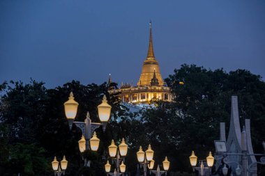the Chedi of the Golden Mount at Wat Saket in Banglamphu in the city of Bangkok in Thailand.  Thailand, Bangkok, December, 9, 2023 clipart