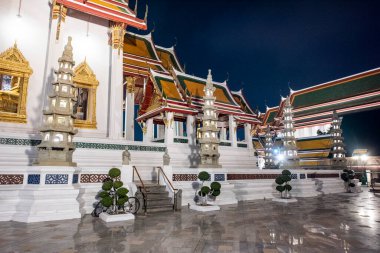 the Wat Suthat Thepwararam Ratchaworamahawihan in Banglamphu in the city of Bangkok in Thailand.  Thailand, Bangkok, December, 9, 2023 clipart