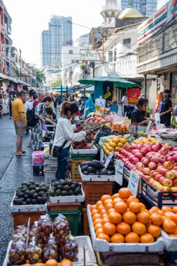 a Fruit market on a street in Silom in the city of Bangkok in Thailand.  Thailand, Bangkok, December, 6, 2023 clipart