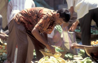 People at a Streetmarket and alley in the city of Chennai in Province Tamil Nadu in India.  India, Chennai, April, 1998 clipart