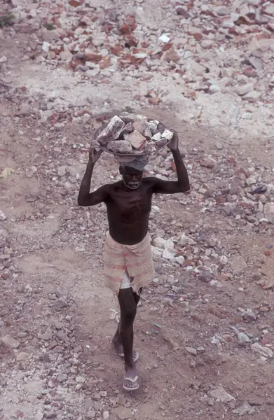 stock image Indian construction worker on handwork at a construction site in the city of Chennai in Province Tamil Nadu in India.  India, Chennai, April, 1998