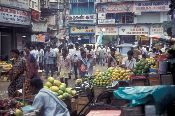 Stock image People at a Streetmarket and alley in the city of Chennai in Province Tamil Nadu in India. India, Chennai, April, 1998