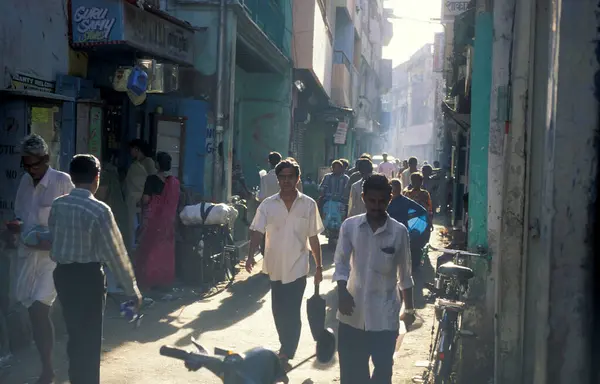 stock image people at a small alley in the city of Chennai in Province Tamil Nadu in India.  India, Chennai, April, 1998