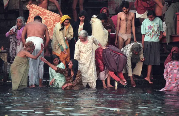 stock image Hindu Pilgrims take a Bath in the Ganges River in the city of Haridwar in the Province Uttarakhand in India.  India, Haridwar, April, 1998