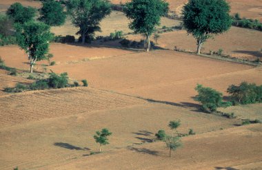 Landscape with fields and agriculture near the town of Hampi in the Province of Karnataka in India.  clipart