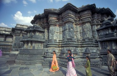 The Hindu Temple Ruins of Chennakeshava Temple with stone carving figures, also  Keshava, Kesava or Vijayanarayana Temple in the town of Belur in the Province of Karnataka in India.  India, Karnataka, March, 1998 clipart