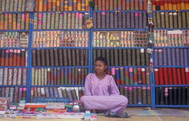 woman at jewelry shop at a market in the city of Mysore in the Province of Karnataka in India.  clipart