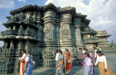 The Hindu Temple Ruins of Chennakeshava Temple with stone carving figures, also  Keshava, Kesava or Vijayanarayana Temple in the town of Belur in the Province of Karnataka in India.  India, Karnataka, March, 1998 clipart