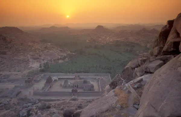 stock image the Achyuta Raya Temple ruins from the Matanga Hill at sunrise in the town of Hampi in the Province of Karnataka in India.  India, Karnataka, March, 1998 