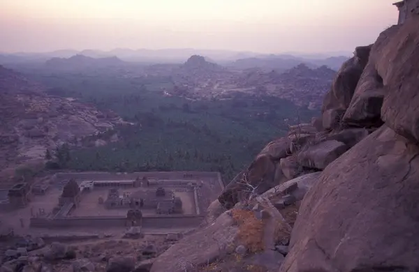 stock image the Achyuta Raya Temple ruins from the Matanga Hill at sunrise in the town of Hampi in the Province of Karnataka in India.  India, Karnataka, March, 1998 