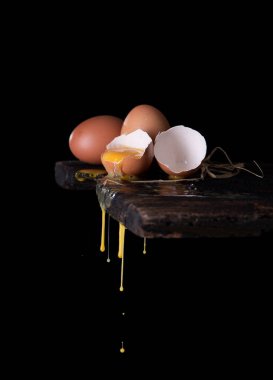 Fresh eggs on wood ,dark background,Copy space