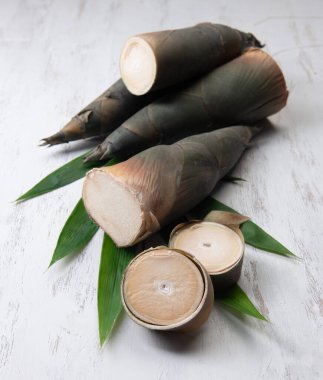 Raw Green Bamboo shoot for cooking food in thailand, on wooden table background