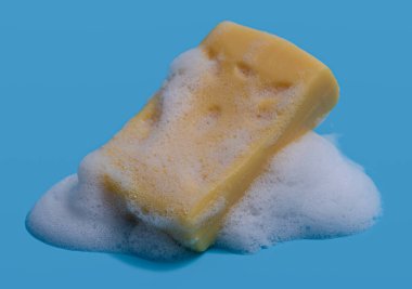 Soap bar and foam on blue background,Mockup for design