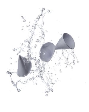 Paper cup, conical shape with water splash, used for drinking water isolated on white background